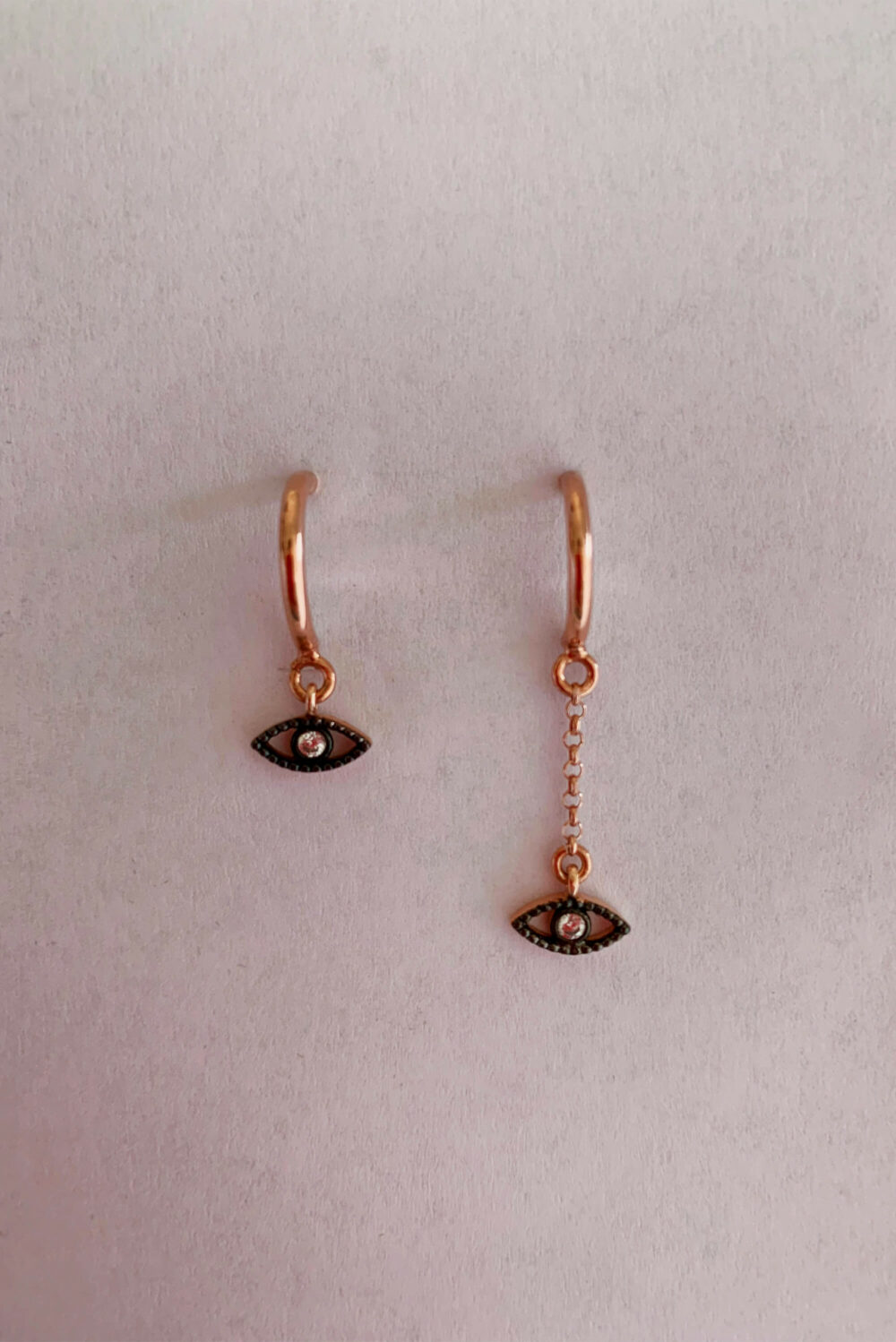 Earrings by Dora Syrrou