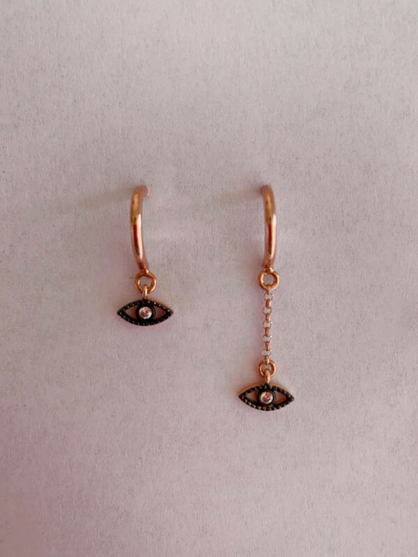 Earrings by Dora Syrrou