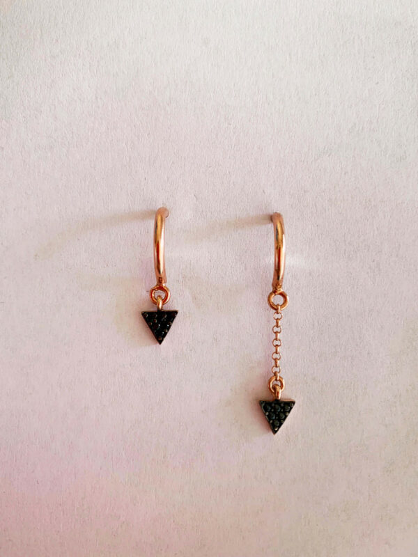 Earrings by Dora Syrrou