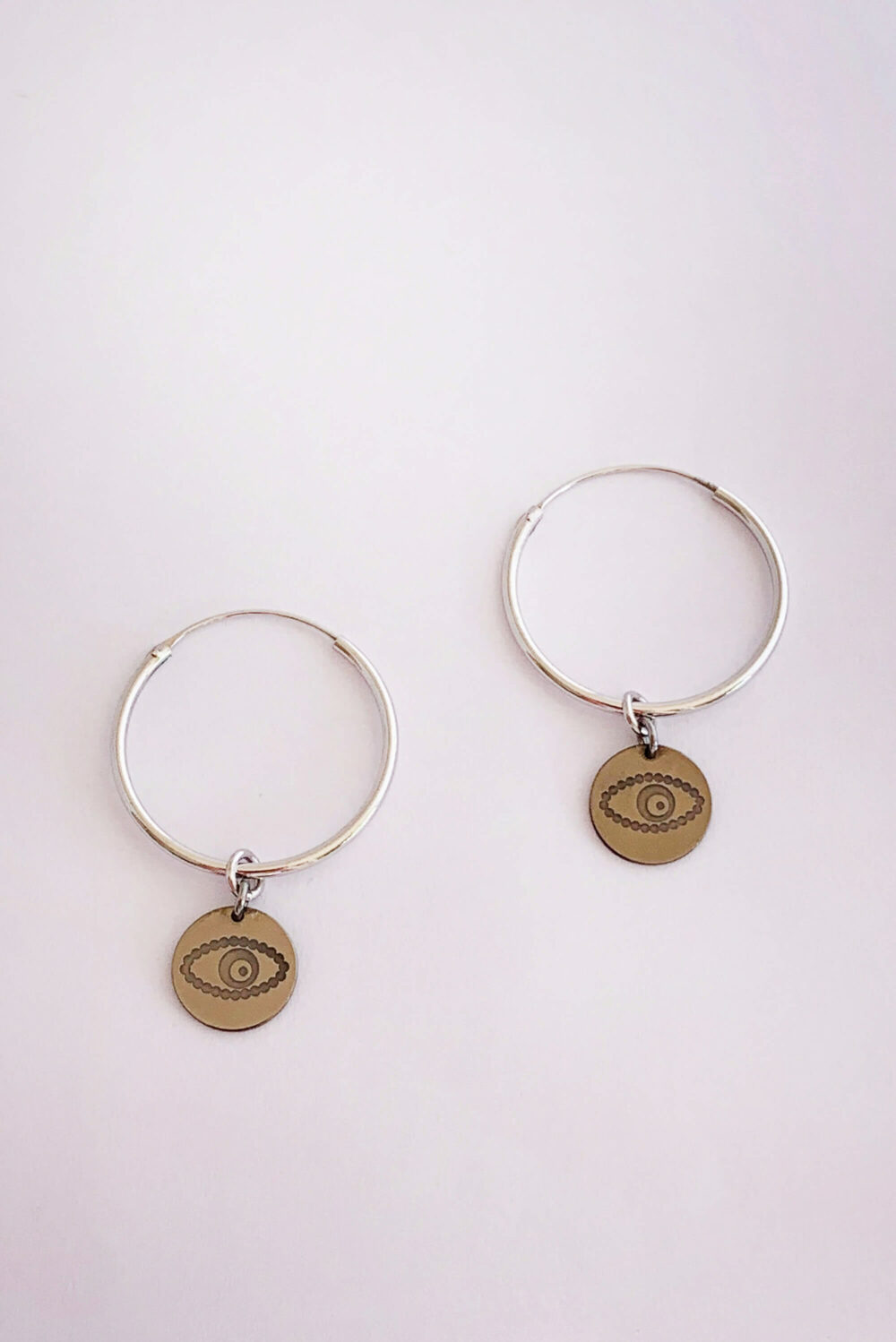 Earrings by Dora Syrrou