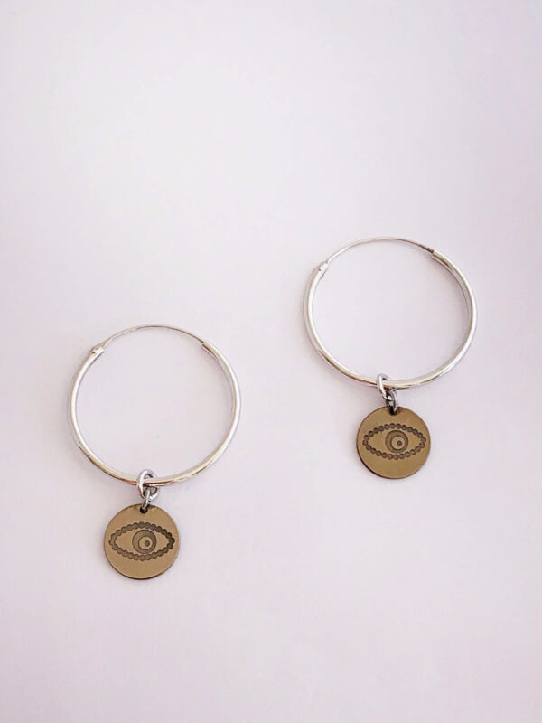 Earrings by Dora Syrrou