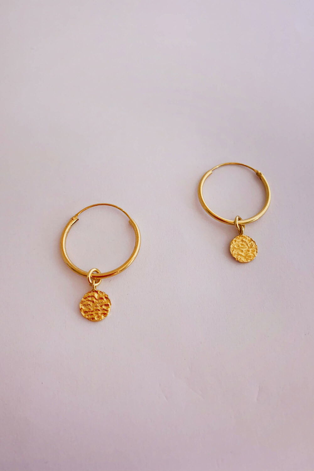 Earrings by Dora Syrrou