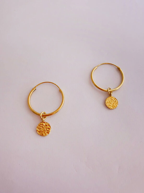 Earrings by Dora Syrrou