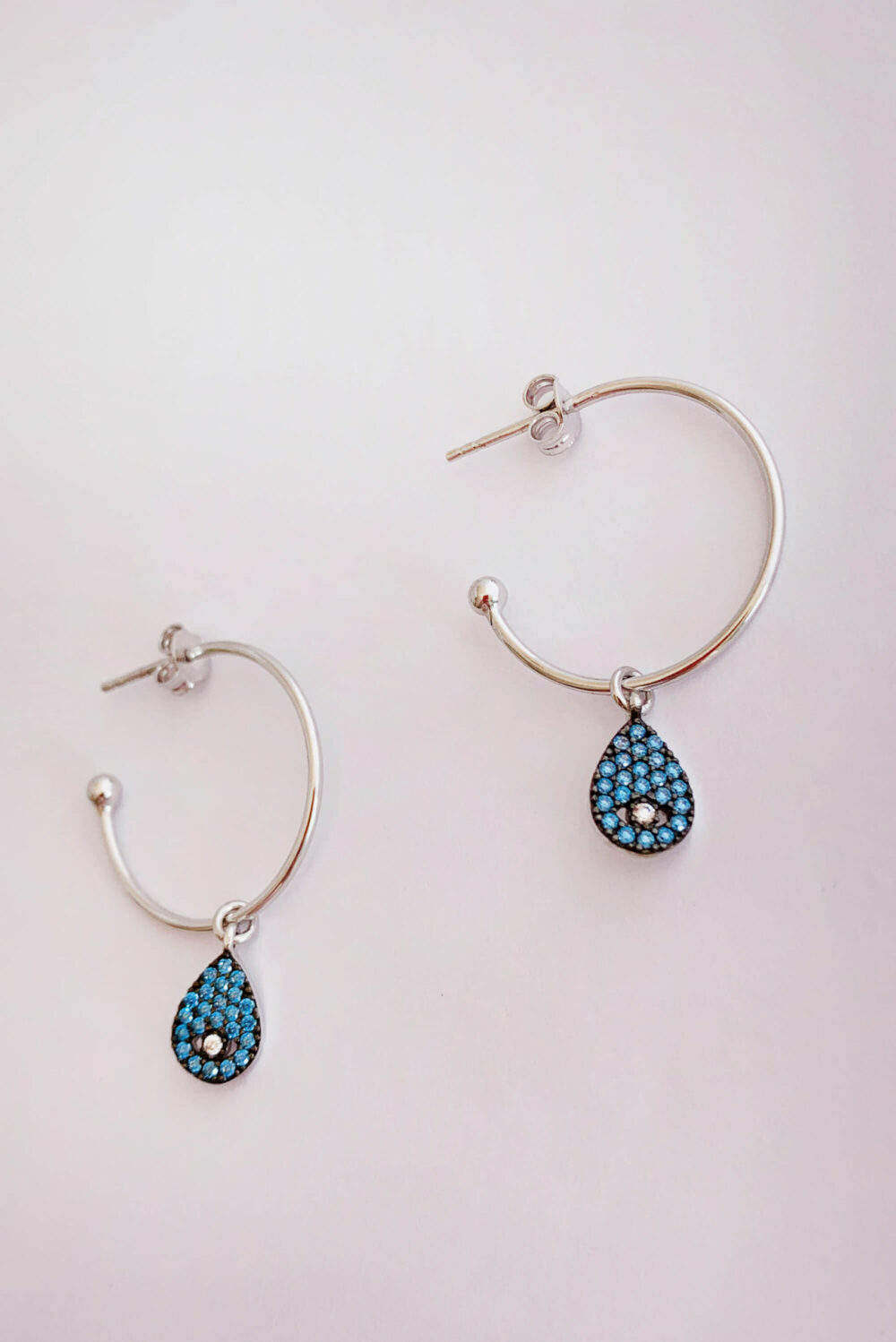 Earrings by Dora Syrrou