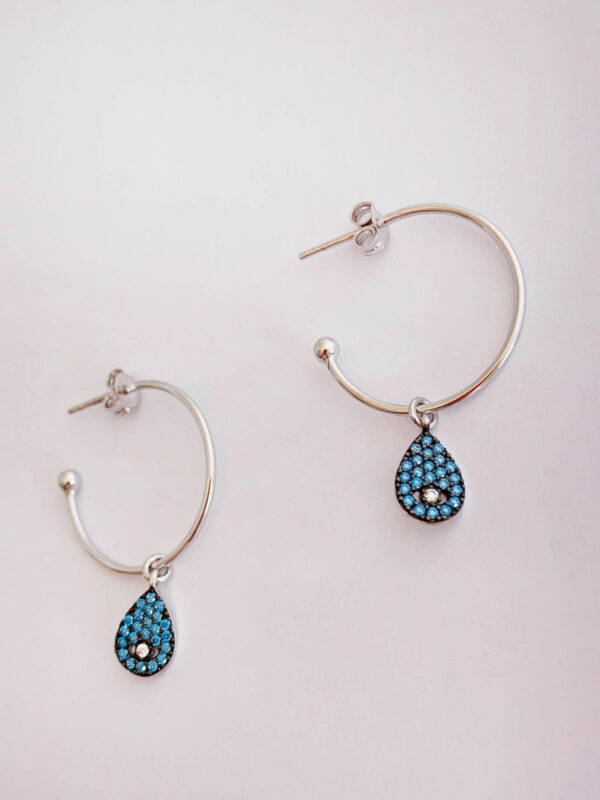 Earrings by Dora Syrrou