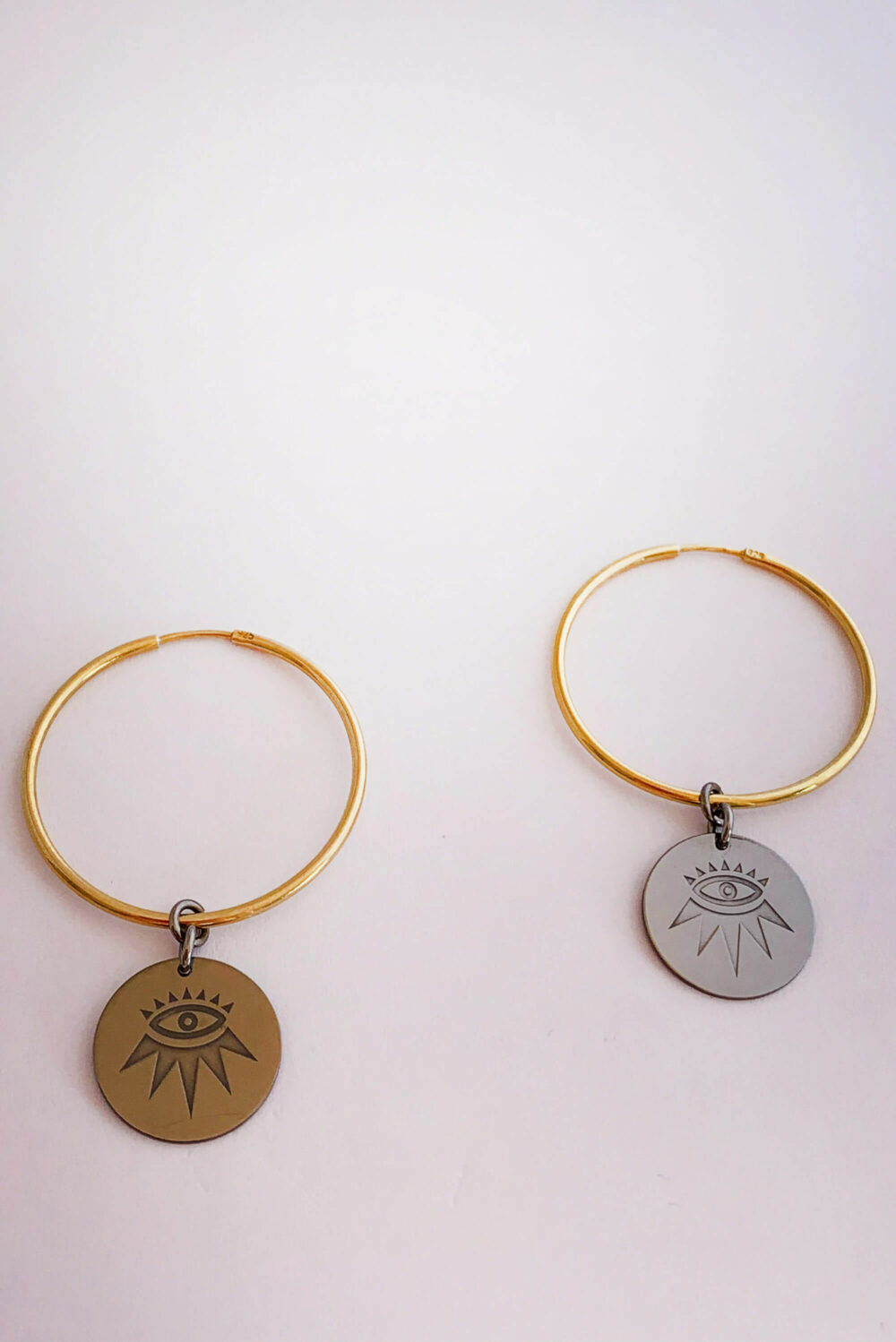 Earrings by Dora Syrrou