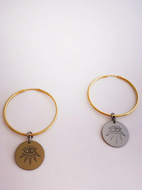 Earrings by Dora Syrrou