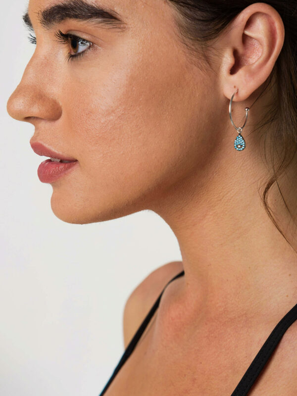 Earrings by Dora Syrrou