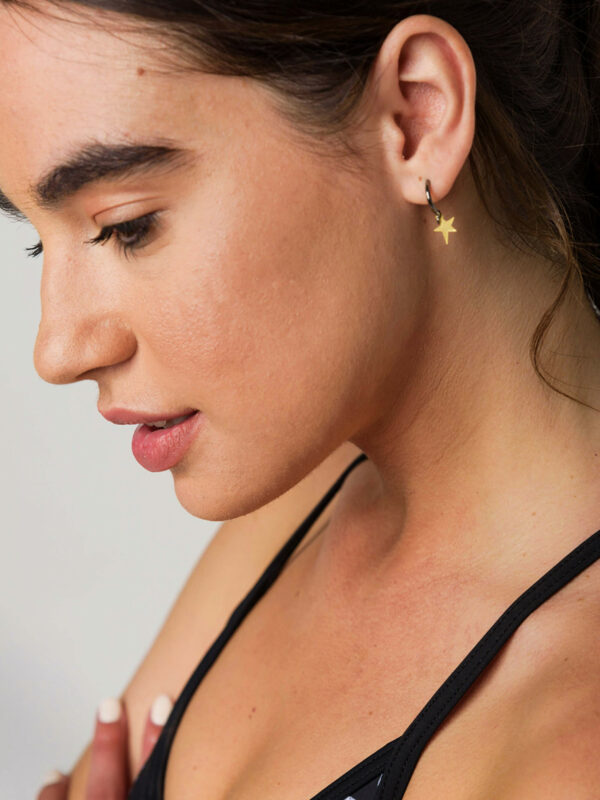 Earrings by Dora Syrrou