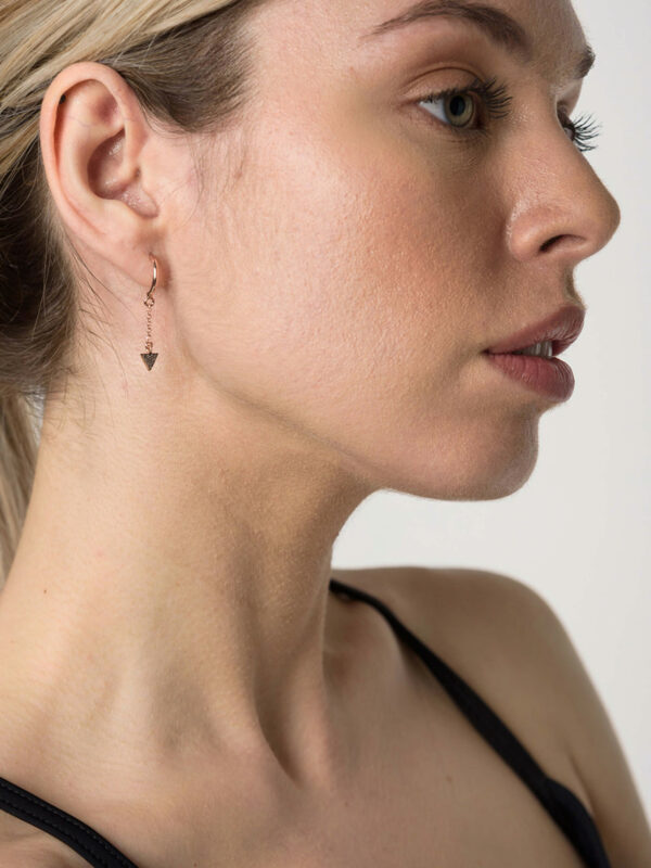 Earrings by Dora Syrrou