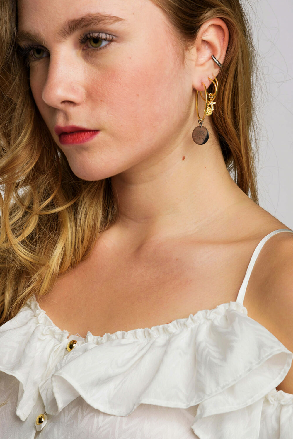 Earrings by Dora Syrrou
