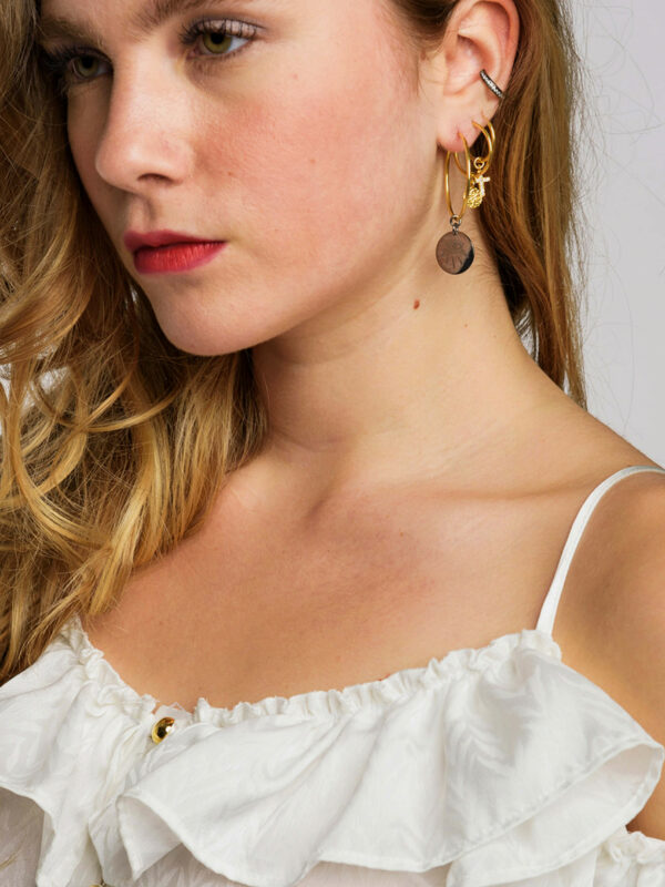 Earrings by Dora Syrrou